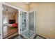 Bathroom featuring tiled shower with a glass door at 19627 Spring Oak Dr, Eustis, FL 32736