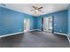 Large bedroom with ensuite bathroom, large closet and french door access to outdoor space at 19627 Spring Oak Dr, Eustis, FL 32736