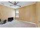 Neutral bedroom with plush carpeting features a ceiling fan and a window with blinds at 19627 Spring Oak Dr, Eustis, FL 32736