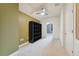 Open carpeted bedroom with a ceiling fan and natural light at 19627 Spring Oak Dr, Eustis, FL 32736