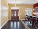 Inviting foyer with decorative front door and dark, stylish flooring at 19627 Spring Oak Dr, Eustis, FL 32736