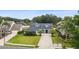 Aerial view of a blue two-story home with a spacious yard and inviting curb appeal at 19627 Spring Oak Dr, Eustis, FL 32736