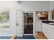 Bright garage features storage racks, natural light, and access to the garage door at 19627 Spring Oak Dr, Eustis, FL 32736