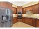 This is a spacious kitchen featuring stainless steel appliances and beautiful wood cabinetry at 19627 Spring Oak Dr, Eustis, FL 32736