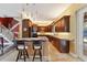 Open-concept kitchen with granite countertops and stainless steel appliances at 19627 Spring Oak Dr, Eustis, FL 32736