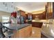 Modern kitchen featuring custom cabinetry, granite countertops, and stainless appliances at 19627 Spring Oak Dr, Eustis, FL 32736