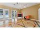 Bright living room with fireplace, French doors to pool, and unique floor design at 19627 Spring Oak Dr, Eustis, FL 32736