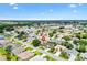 Beautiful aerial view of the neighborhood showcasing nearby lake and landscaping at 2015 Palo Alto Ave, The Villages, FL 32159