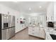 A modern kitchen featuring granite countertops, stainless steel appliances, and ample cabinet space at 2015 Palo Alto Ave, The Villages, FL 32159