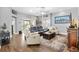 Comfortable living room boasts a ceiling fan, recessed lighting and plush seating with views to patio at 2015 Palo Alto Ave, The Villages, FL 32159