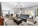 Large living room featuring recessed lighting, hardwood floors, fan and plush leather seating arrangement at 2015 Palo Alto Ave, The Villages, FL 32159