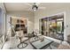 Enclosed patio features neutral tones, ceiling fan, and sliding glass doors for indoor/outdoor living at 2015 Palo Alto Ave, The Villages, FL 32159