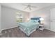 Bedroom with plush carpet, blue accents, and a bright window at 2022 Claudio Ln, The Villages, FL 32159