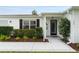 Inviting front entrance with well-maintained landscaping and a tiled walkway leading to the front door at 2022 Claudio Ln, The Villages, FL 32159