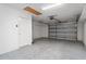 Spacious garage with an epoxy floor, providing ample room for parking and storage at 2022 Claudio Ln, The Villages, FL 32159