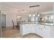 Kitchen bar with granite counter top open to dining room and living room at 2022 Claudio Ln, The Villages, FL 32159