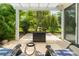Cozy patio with a fire pit, surrounded by lush greenery and offering a peaceful outdoor retreat at 2022 Claudio Ln, The Villages, FL 32159