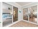 Sunroom view of the bedroom with large sliding glass doors, providing plenty of natural light at 2022 Claudio Ln, The Villages, FL 32159