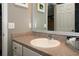 Cozy bathroom features a neutral color scheme with vanity and ample counter space at 2039 Thurmond Ave, The Villages, FL 32162