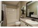 Clean bathroom with a tub/shower combo and updated fixtures at 2039 Thurmond Ave, The Villages, FL 32162