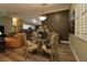 Elegant dining room with stylish chandelier, decorative wall art and luxury chair design at 2039 Thurmond Ave, The Villages, FL 32162