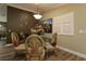 Elegant dining room with stylish chandelier, decorative wall art and luxury chair design at 2039 Thurmond Ave, The Villages, FL 32162
