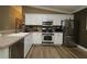 Modern kitchen featuring stainless steel appliances and white cabinets at 2039 Thurmond Ave, The Villages, FL 32162