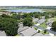 Scenic aerial view of a residential community near a serene lake and lush trees at 2131 Burley Ave, Clermont, FL 34711