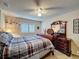 Comfortable bedroom with a ceiling fan, a large bed, and coordinated furnishings at 2131 Burley Ave, Clermont, FL 34711