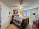 Relaxing bedroom with a ceiling fan, plantation shutters, and matching dresser at 2131 Burley Ave, Clermont, FL 34711