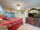 Spacious bedroom with natural light, features an ornate dresser and a decorative bed frame at 2131 Burley Ave, Clermont, FL 34711