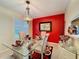 Bright dining room features a glass table with seating for four and colorful decor accents at 2131 Burley Ave, Clermont, FL 34711