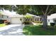 Charming single-story home featuring a well-maintained lawn and attractive landscaping at 2131 Burley Ave, Clermont, FL 34711