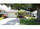 Charming single-story home featuring a well-maintained lawn and attractive landscaping at 2131 Burley Ave, Clermont, FL 34711