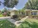 Single-story home with landscaped front yard, walkway, and two car garage showcasing its curb appeal at 2131 Burley Ave, Clermont, FL 34711