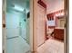 Hallway leading to laundry and bathroom, showcasing convenient access to essential areas of the home at 2131 Burley Ave, Clermont, FL 34711