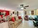 Spacious living room with tile floors, a ceiling fan, and comfortable seating arrangements at 2131 Burley Ave, Clermont, FL 34711