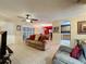 Open concept view from the living room towards the dining area and kitchen at 2131 Burley Ave, Clermont, FL 34711