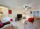 Inviting living room with comfortable seating, a ceiling fan, and ample natural light at 2131 Burley Ave, Clermont, FL 34711