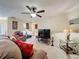 Cozy living room featuring comfortable seating, accent lamps, and a modern television set at 2131 Burley Ave, Clermont, FL 34711