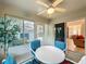 Bright sunroom with patio furniture, neutral colored walls, and fan at 2131 Burley Ave, Clermont, FL 34711