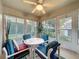 Bright sunroom with patio furniture, neutral colored walls, and fan at 2131 Burley Ave, Clermont, FL 34711