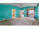 Primary bedroom with walk-out access to patio and en suite bathroom at 22217 Caledonia Dr, Leesburg, FL 34748