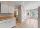 Open dining area has tile flooring, natural light, and access to the front door at 22217 Caledonia Dr, Leesburg, FL 34748