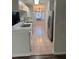 Bright kitchen with white cabinets and stainless steel appliances and tile floors at 2381 Missouri Ave, St Cloud, FL 34769