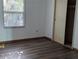 A bedroom featuring light-colored wood laminate flooring and a closet at 2871 Myakka River Rd, Tavares, FL 32778