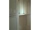Close-up on cabinet with off-white paint, offering ample storage space at 2871 Myakka River Rd, Tavares, FL 32778