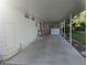 A spacious, covered carport with a tiled floor, offering ample parking and protection from the elements at 2871 Myakka River Rd, Tavares, FL 32778