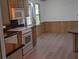 Kitchen featuring matching appliances, wood cabinets and eat-in breakfast nook at 2871 Myakka River Rd, Tavares, FL 32778