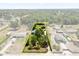 Aerial view of property highlighting home, pool, outbuilding and surrounding lush landscaping at 28924 Discovery Rd, Tavares, FL 32778